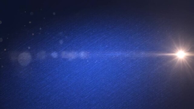 Blue Abstract Background with Radiant Light Flare and Particle Effects