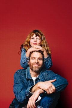 Connection between father and daughter brings warm family feeling to this studio portrait