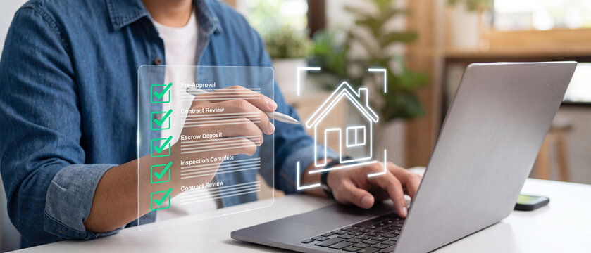 Real estate agent using laptop to manage home buying process with digital checklist and house icon overlay