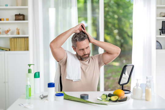 Hairdresser. Man with hairbrush at home. Male beauty hairstyle. Haircare and hair loss. Man use hair comb. Comb and hairbrush. Brushing hair. Mature man combing hair
