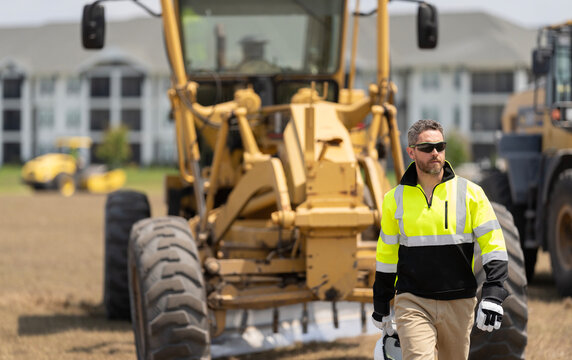 Man engineer at building site. Supervisor worker wear uniform. Top supervisor at work. Labor day. Building side outdoor. Man at construction site. Civil construction engineering. Crane operator