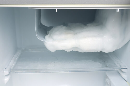 heavy ice buildup covering freezer compartment inside household refrigerator excessive frost accumulation freezing unit poor cooling efficiency lack of defrosting, appliance maintenance home repair