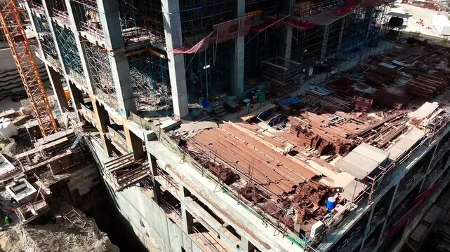 Panoramic view of skyscraper building construction progress in an urban commercial zone.