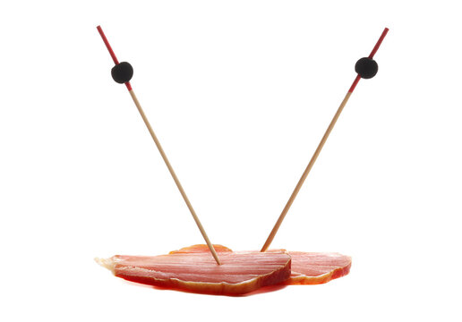 Traditional cured meat, smoked slices with wooden toothpicks isolated on white background, side view