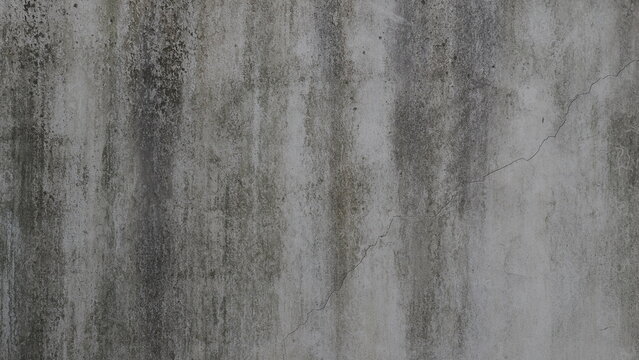 Full frame of weathered grey concrete wall texture background with stain and crack