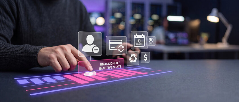 Businessman interacting with a holographic interface to manage unassigned and inactive software seats for cost optimization