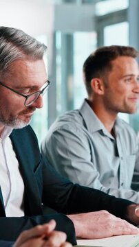 Meeting, listening and business men in workshop for corporate training or learning in insurance agency. Office, agent and team with customer objection education, sales pitch and upskill seminar