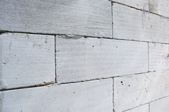 Light gray lightweight concrete block or autoclaved aerated concrete AAC brick wall