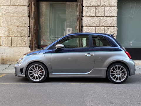 Abarth 595 Rivale compact sports car parked in Cremona, Italy, highlighting a special edition vehicle's design and urban setting