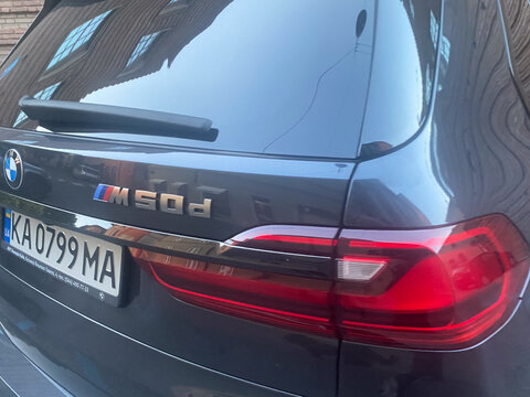 BMW X7 M50d SUV rear highlighting the M performance badging, brand emblem, and contemporary taillight