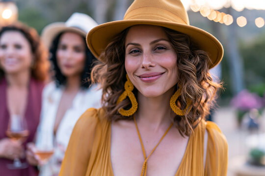 A breathtaking and highly detailed view of group of Hispanic women relaxing at a sophisticated outdoor event, garden setting, bright sunny weather, premium advertising photography.