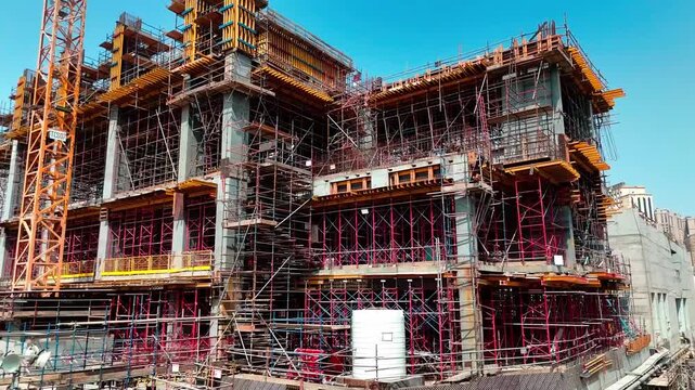 Industrial building construction framework showing steel rebar grid and structural engineering.
