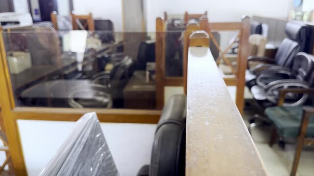 Empty Office Chairs and Tables Inside Old Styled Cabins Showing Abandoned Workplace Furniture, Traditional Office Interior and Neglected Workspace Environment