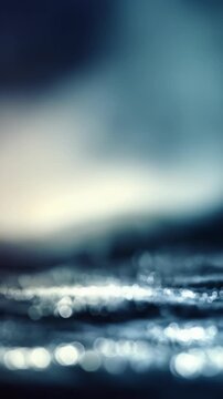 Moody abstract image featuring a smooth blend of deep blue and white hues with gentle bokeh highlights. The ethereal ambiance makes it ideal for creative, futuristic, or meditative design projects