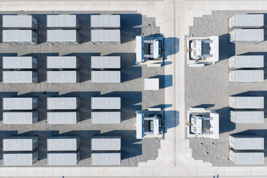 Aerial view of battery energy storage system facility for renewable power plant. Industrial lithium batteries used for clean electricity grid management.