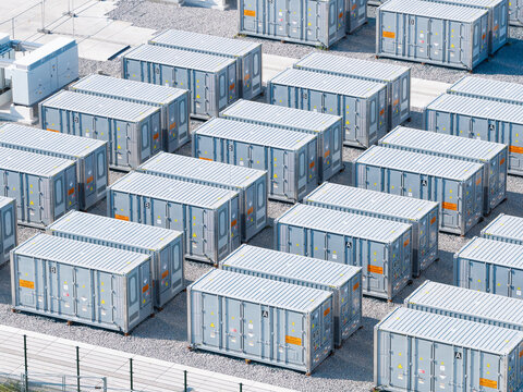Aerial view of battery energy storage system facility for renewable power plant. Industrial lithium batteries used for clean electricity grid management.