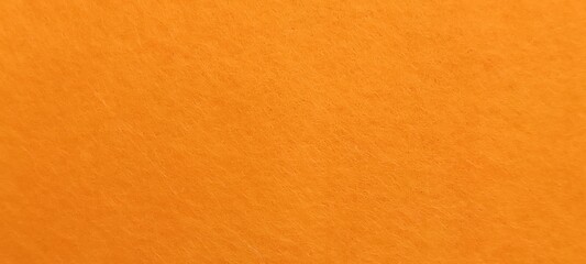 Naklejka premium Vibrant orange textured surface background