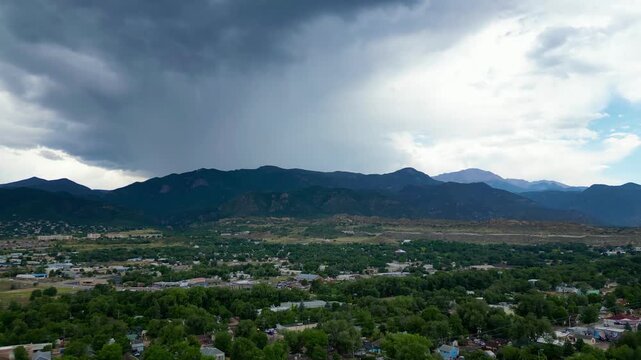 Aerial drone flyover of cloudy, rainy mountain region