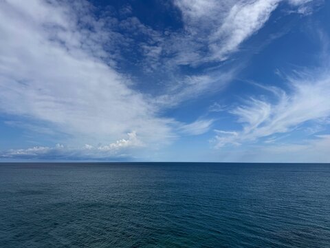 Open sea and blue sky covered beautiful clouds.