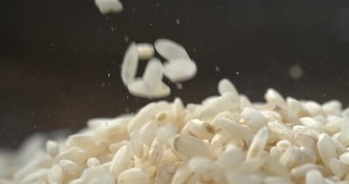 White rice grains falling in super slow motion