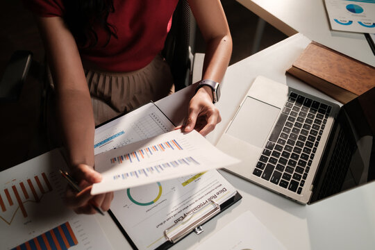 Business professional analyzing financial data report charts