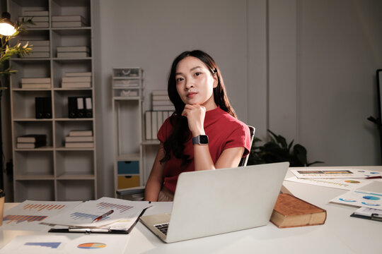 Asian businesswoman working late in modern office