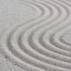 Naklejka premium Zen Garden Sand Ripples Japanese Rock Garden Texture for Minimal Background and Wellness Design