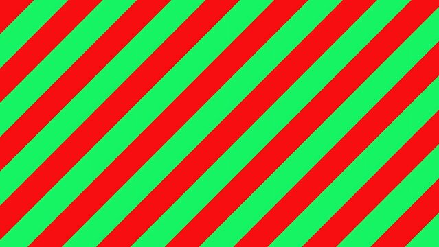 Bright red and green diagonal stripe pattern background for vibrant holiday wallpaper or festive wrapping paper texture