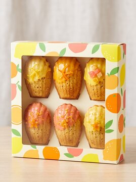 Citrus madeleine six-pack in a colorful bakery box