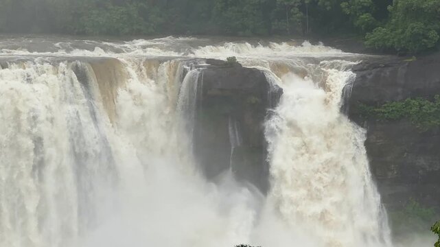 Athirappilly Waterfalls Niagara of India  Kerala largest waterfall. Flooding river in lush rainforests of the Western Ghats. Tropical  Athirapally Vazhachal  Charpa Falls, Indian