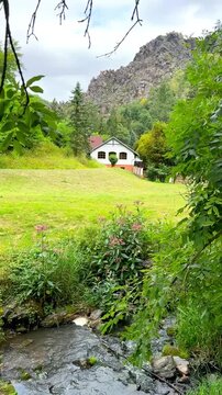 Cottage with Green Meadow and Forested Hills in Divoka Sarka Prague
