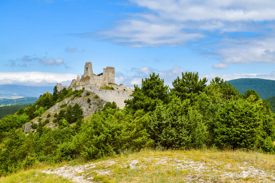 Castle ruin crowning a limestone crag in summer
