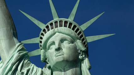 Close up of the Statue of Liberty's face on a sunny day, in New York, United States © ph_sadore