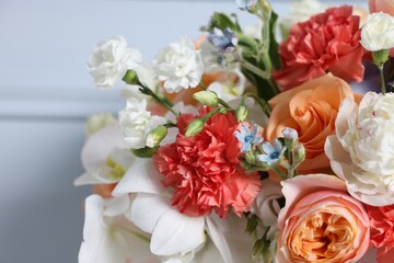 Obraz premium Beautiful colorful flowers on light background, closeup