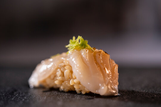 Nigiri sushi with seared scallop and lime zest