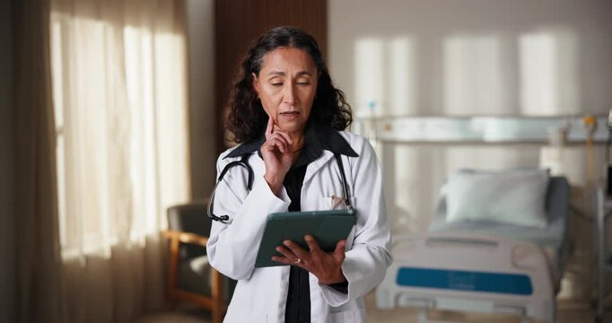 Woman, doctor and reading in hospital with tablet, research and medical records for treatment. Thinking, mature surgeon and ideas in icu ward with digital, telehealth and test results for healthcare