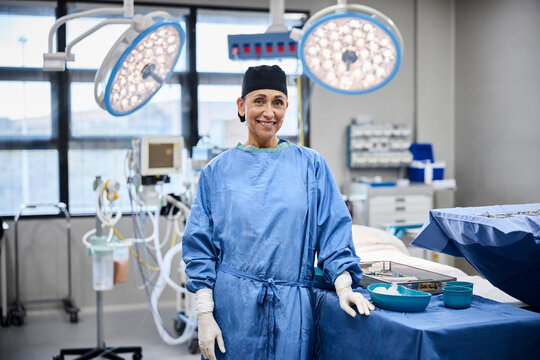 Smiling surgeon in operating room ready for procedure