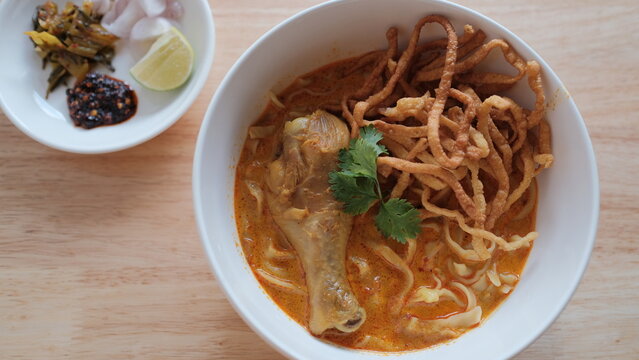Noodle with meat pork meatball chicken curry soup , Thai called khao soi kai ,Northern food of thailand