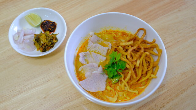Noodle with meat pork meatball chicken curry soup , Thai called khao soi kai ,Northern food of thailand