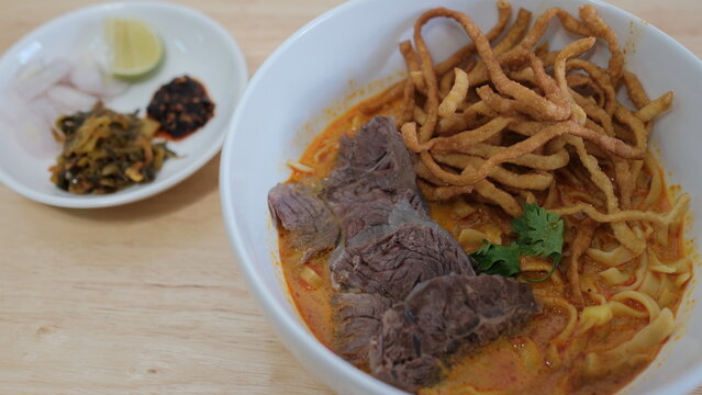 Noodle with meat pork meatball chicken curry soup , Thai called khao soi kai ,Northern food of thailand