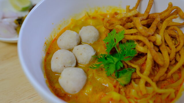 Noodle with meat pork meatball chicken curry soup , Thai called khao soi kai ,Northern food of thailand