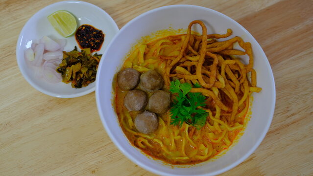 Noodle with meat pork meatball chicken curry soup , Thai called khao soi kai ,Northern food of thailand