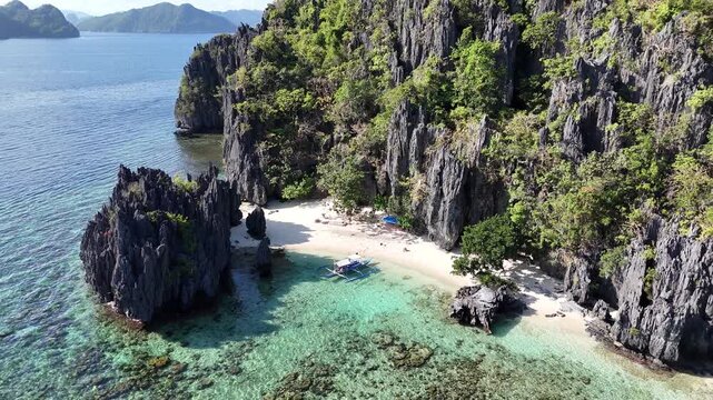 Aerial View of Tropical Beach with Traditional Fishing Boat in El Nido Palawan Philippines