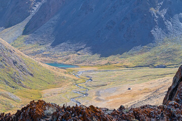High-altitude remote glacial lake in the valley of Sebystey river, Sailughem Range, Altai. Located in the alpine tundra of the Sailughem Range, Kosh-Agachsky region © prambuwesas