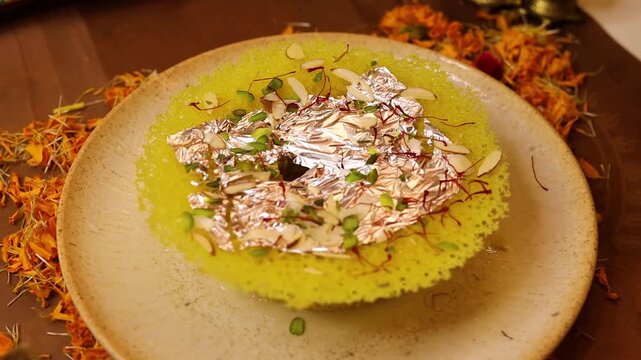 Ghewar a rajasthani sweet garnished with dry fruits & rabdi