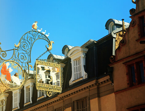 Colmar, France  Aux Deux Fr&egrave;res sign, a wrought iron artwork The sign was designed by the artist Jean-Jacques Waltz, this intricate shop sign is a classic example of traditional Alsatian craftsmanship