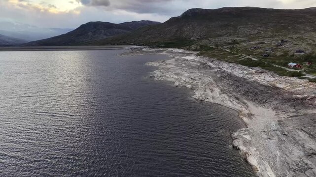 Aerial view showing a worryingly low water level in the Aursjoedammen hydroelectric dam.