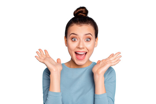 Close up photo cute charming lady astonished impressed incredible news gift present desire dream surprise shout scream open mouth raise hand palm dressed modern cotton outfit isolated blue background