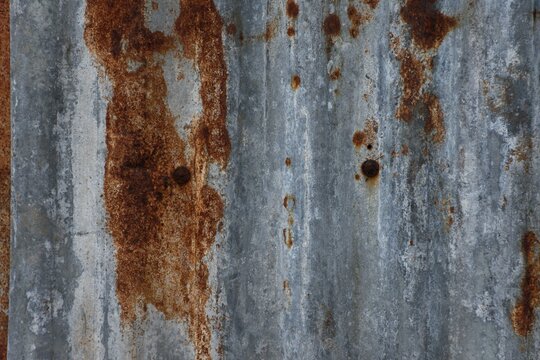 Old corrugated zinc sheet with rust background