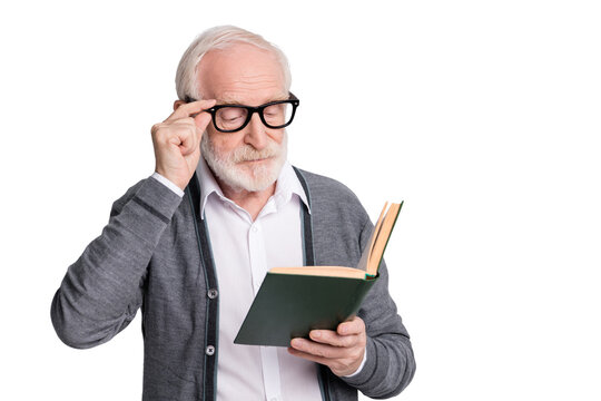 Portrait of old white hair serious man read book wear spectacles dark sweater isolated on grey background